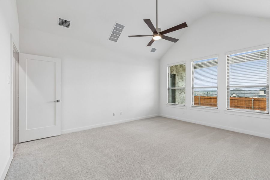 Primary Suite in the Claret home plan by Trophy Signature Homes – REPRESENTATIVE PHOTO