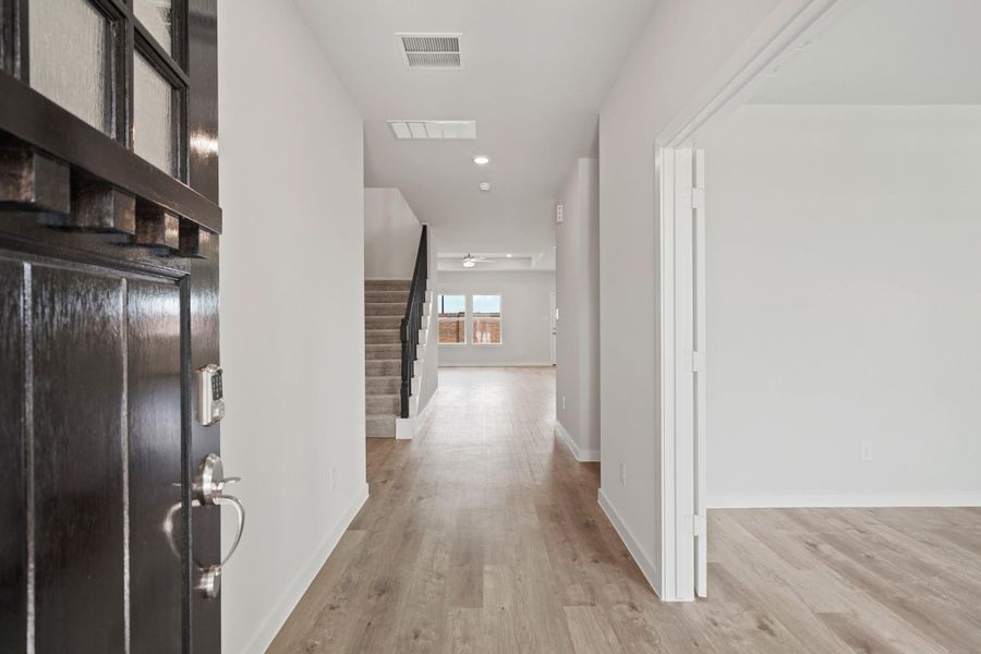 Spacious, unfurnished interior of a new home in Sunterra, Katy (Image 13).