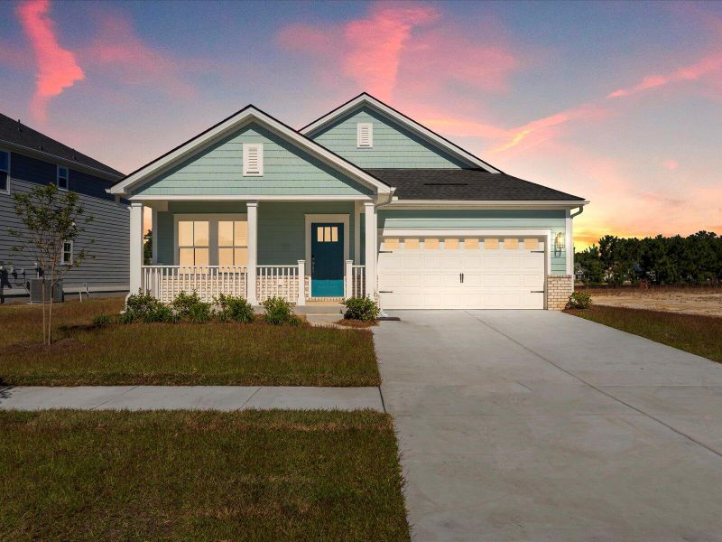 Front exterior of a new home in The Coves at Lakes of Cane Bay, Summerville, SC, highlighting curb appeal (Image 2). Front exterior of a new home in The Coves at Lakes of Cane Bay, Summerville, SC, highlighting curb appeal (Image 2).
