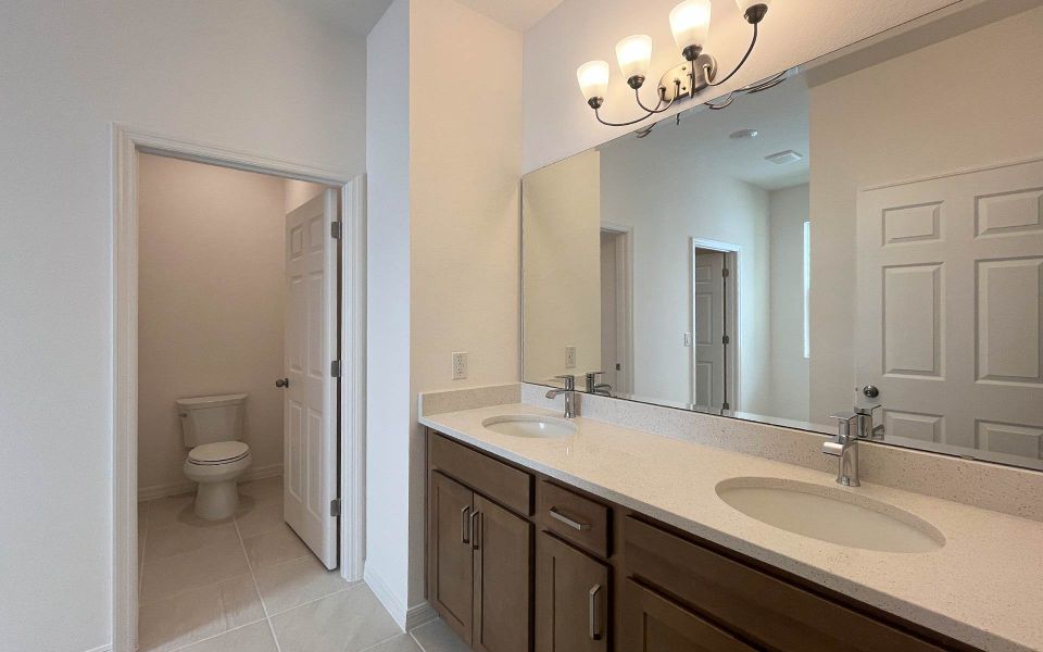 Elegant Primary Bathroom with Upgraded Finishes in Central Florida Home Elegant Primary Bathroom with Upgraded Finishes in Central Florida Home