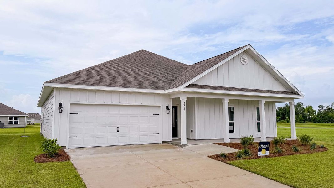 Front exterior of a new home in Hodges Bayou Plantation, Panama City, FL, highlighting curb appeal (Image 2). Front exterior of a new home in Hodges Bayou Plantation, Panama City, FL, highlighting curb appeal (Image 2).