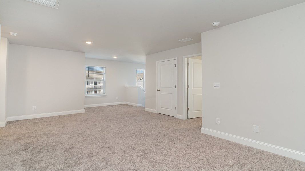Representative unfurnished interior of a home built from the Belfort by D.R. Horton in Heron Pointe, Myrtle Beach (Image 27).
