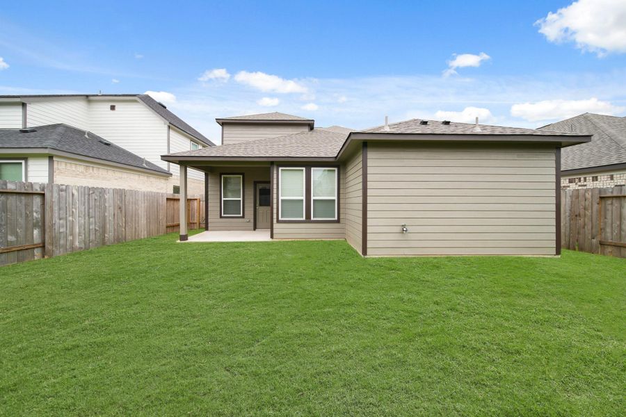 Front exterior of a new home in Barton Creek Ranch, Conroe, TX, highlighting curb appeal (Image 16). Front exterior of a new home in Barton Creek Ranch, Conroe, TX, highlighting curb appeal (Image 16).