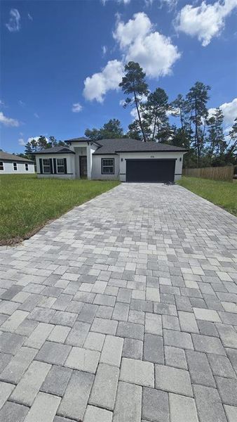 Front exterior of a new home in , Ocala, FL, highlighting curb appeal (Image 1).