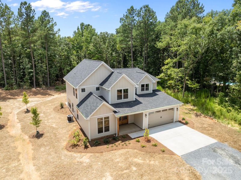 Front exterior of a new home in , Richfield, NC, highlighting curb appeal (Image 24).