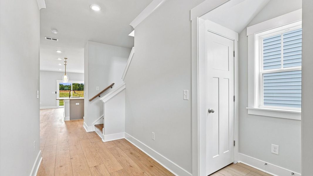 Refined foyer with hardwood floors and thoughtful design for a first-rate welcome Refined foyer with hardwood floors and thoughtful design for a first-rate welcome