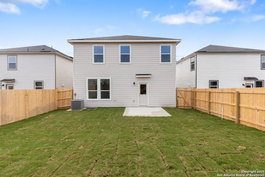 Exterior details and patio area of a home in Southton Cove, Elmendorf (Image 3).