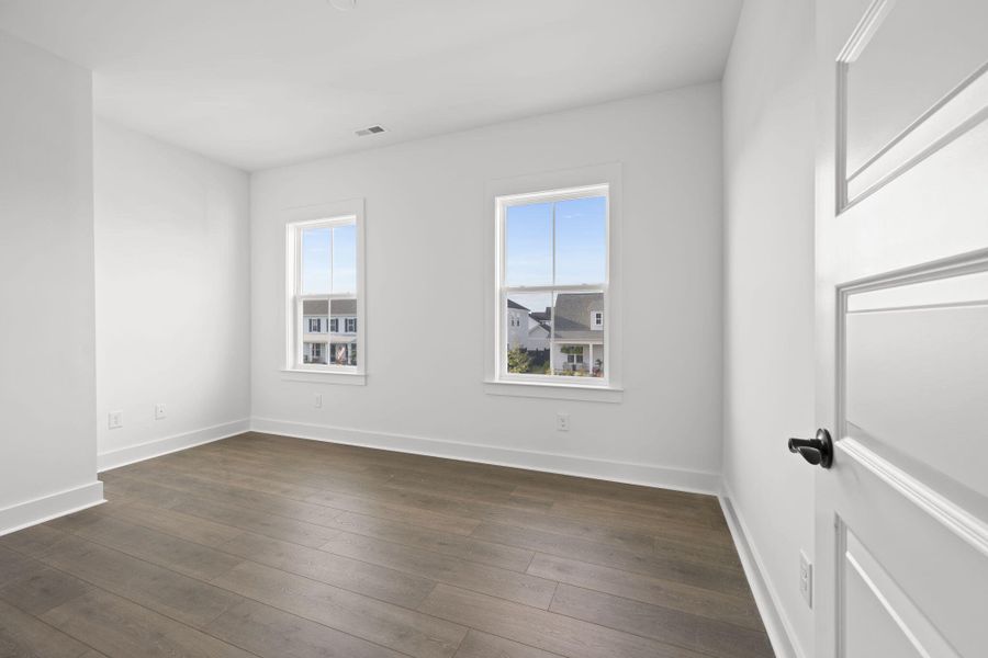 Spacious, unfurnished interior of a new home in The Domus Collection at Midtown Nexton, Summerville (Image 39).