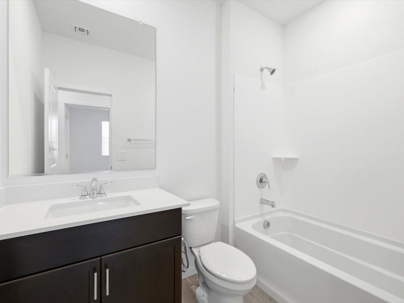 Furnished interior view inside a new home in Silva Farms - Classic Series, Goodyear (Image 9).
