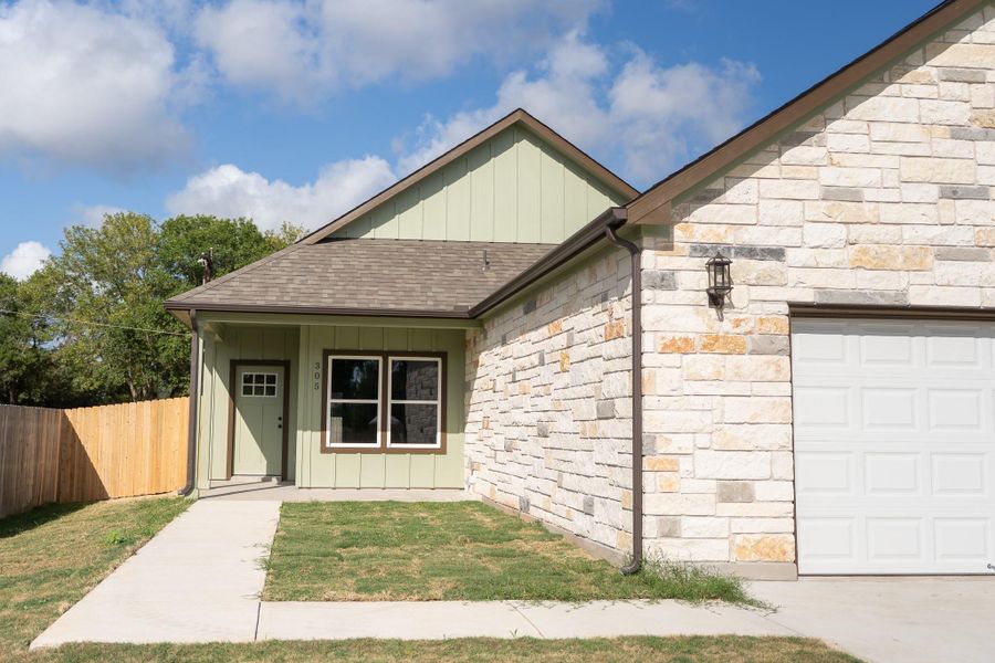 Front exterior of a new home in , Smithville, TX, highlighting curb appeal (Image 18).