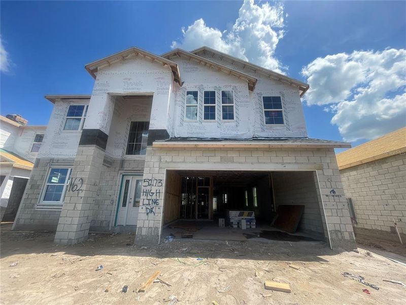 In-progress construction of a new home in Center Lake on the Park, St. Cloud, FL (Image 24).