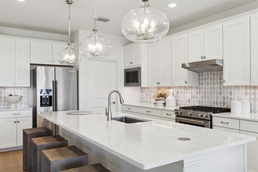 *Model Representation - Spacious kitchen with eat-in bartop island