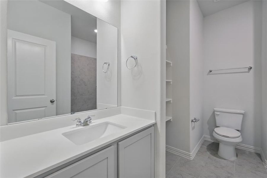 Full bathroom with vanity and toilet