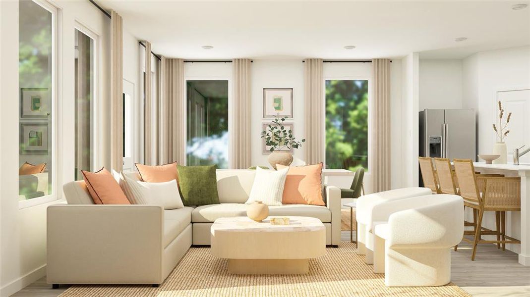 Sitting room featuring plenty of natural light and light wood-type flooring