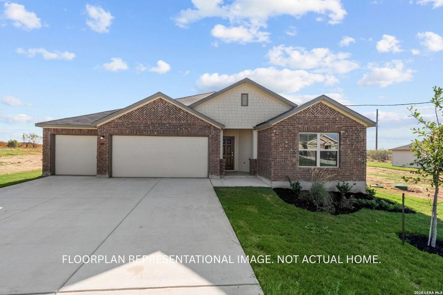 Front exterior of a new home in Hickory Ridge, Elmendorf, TX, highlighting curb appeal (Image 2). Front exterior of a new home in Hickory Ridge, Elmendorf, TX, highlighting curb appeal (Image 2).