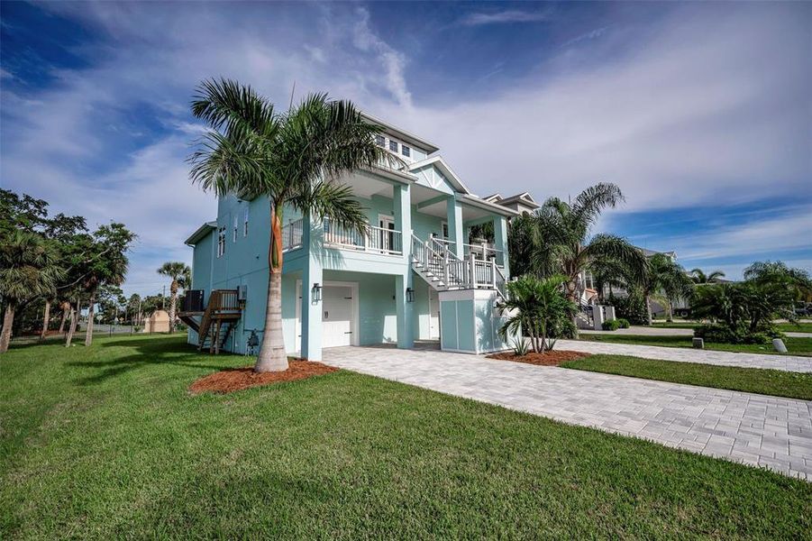Front exterior of a new home in , New Port Richey, FL, highlighting curb appeal (Image 25). Front exterior of a new home in , New Port Richey, FL, highlighting curb appeal (Image 25).