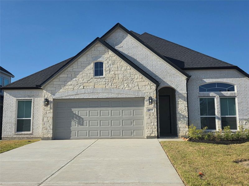 Front exterior of a new home in Barton Creek Ranch, Conroe, TX, highlighting curb appeal (Image 1). Front exterior of a new home in Barton Creek Ranch, Conroe, TX, highlighting curb appeal (Image 1).