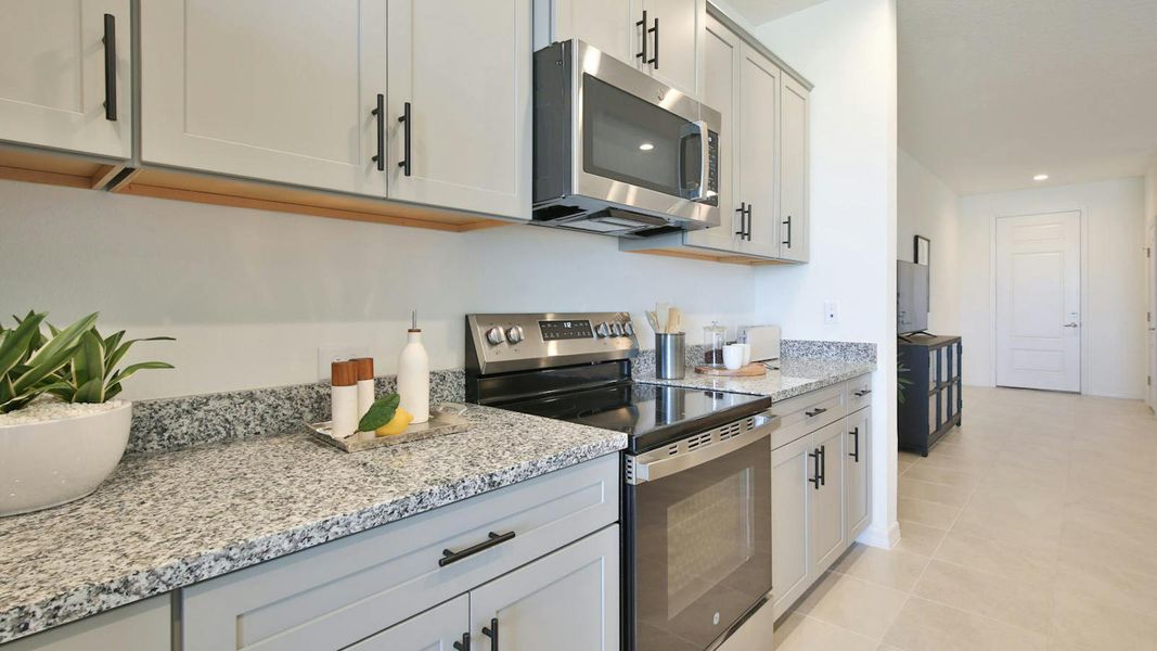 Furnished interior view inside a new home in Palm Grove Real Estate and Homes for Sale in Lakewood Ranch, FL - Neal Communities, Lakewood Ranch (Image 26).