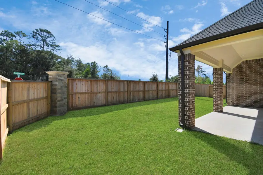 Experience outdoor living at its finest on this expansive covered patio, thoughtfully designed for BBQs and delightful outdoor dining. Sample photo of completed home with similar floor plan. Actual colors and selections may vary. Experience outdoor living at its finest on this expansive covered patio, thoughtfully designed for BBQs and delightful outdoor dining. Sample photo of completed home with similar floor plan. Actual colors and selections may vary.