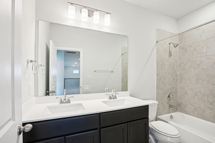 Furnished interior view inside a new home in Del Bello Lakes 60', Manvel (Image 13).