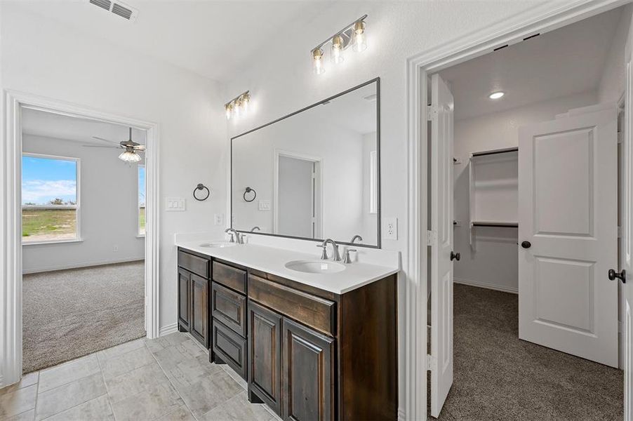 Bathroom with vanity and ceiling fan