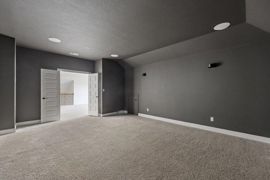 Unfurnished room with light carpet and baseboards Unfurnished room with light carpet and baseboards