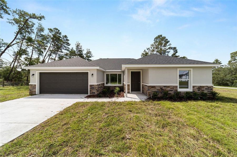 Front exterior of a new home in , Silver Springs, FL, highlighting curb appeal (Image 22).