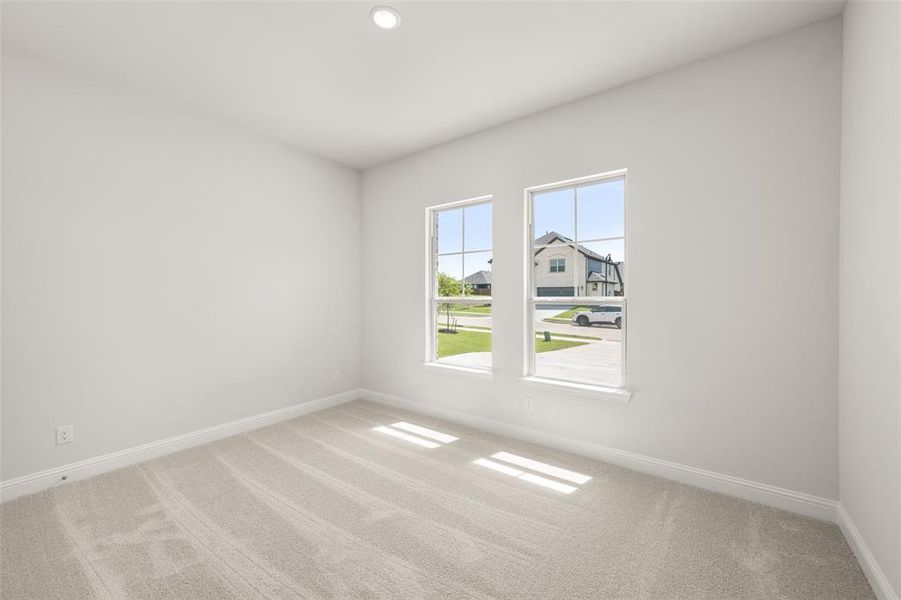 Empty room featuring carpet flooring and recessed lighting Empty room featuring carpet flooring and recessed lighting