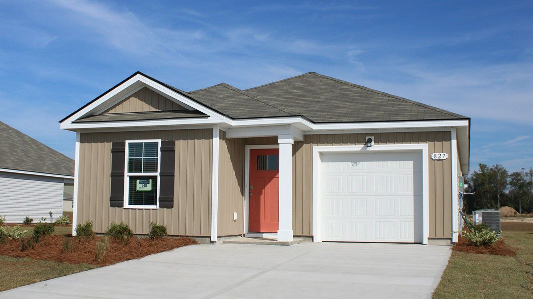 Front exterior of a new home in Sutton Farm, Loris, SC, highlighting curb appeal (Image 2). Front exterior of a new home in Sutton Farm, Loris, SC, highlighting curb appeal (Image 2).