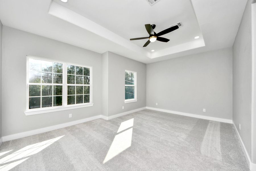 Spacious master bedroom with lots of natural light.