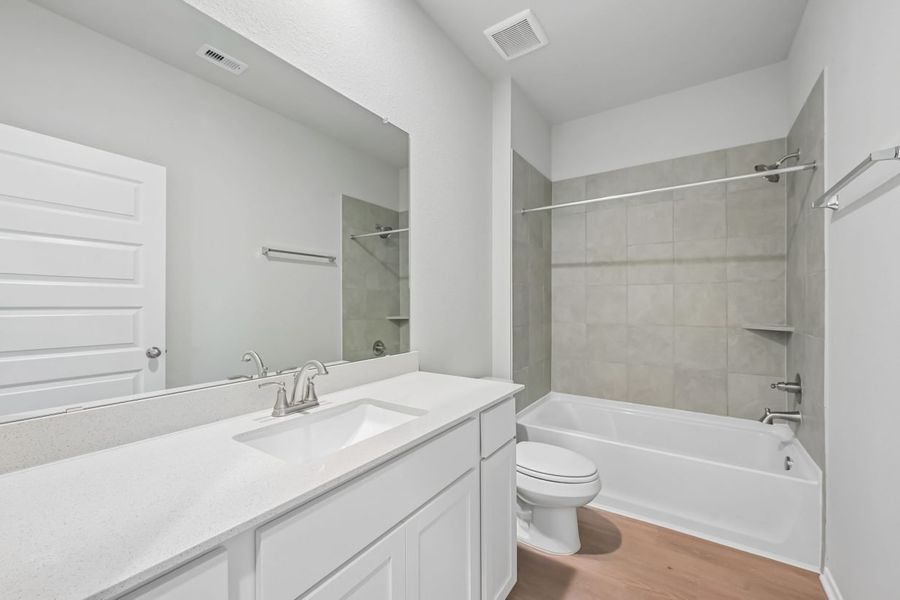Furnished interior view inside a new home in Azalea, Pattison (Image 12).