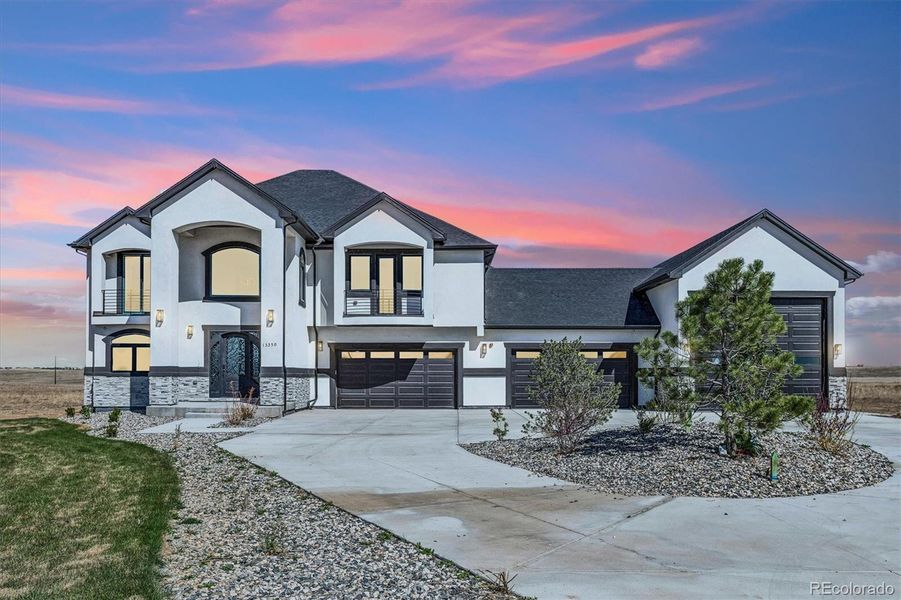 Front exterior of a new home in , Hudson, CO, highlighting curb appeal (Image 27).