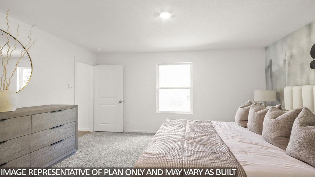 Bedroom featuring light colored carpet and baseboards
