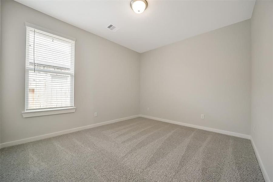 Spacious, unfurnished interior of a new home in Sunterra, Katy (Image 50).