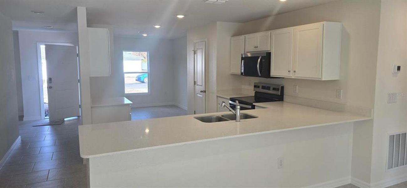 Furnished interior view inside a new home in , Poinciana (Image 5). Furnished interior view inside a new home in , Poinciana (Image 5).