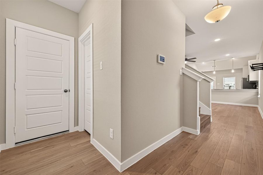 View from front entryway showing guest bathroom doorway. View from front entryway showing guest bathroom doorway.