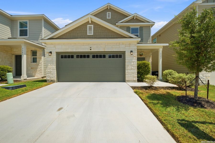 Front exterior of a new home in Senna, San Antonio, TX, highlighting curb appeal (Image 22).