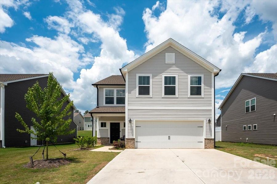 Front exterior of a new home in , Oakboro, NC, highlighting curb appeal (Image 27).