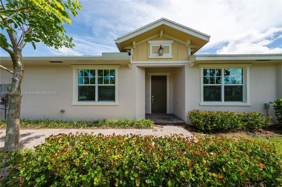 Front exterior of a new home in , Loxahatchee, FL, highlighting curb appeal (Image 23).