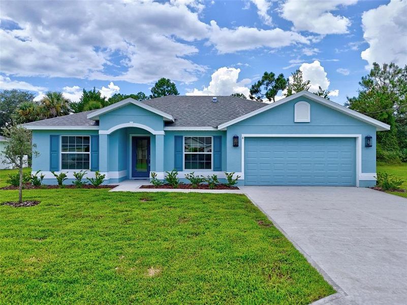 Front exterior of a new home in , Palm Coast, FL, highlighting curb appeal (Image 1).