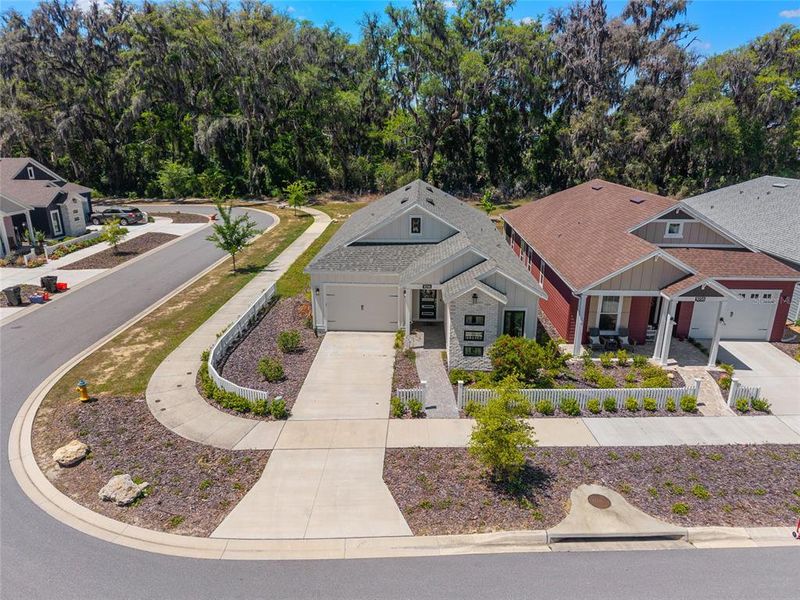 Front exterior of a new home in Fairway Pointe at West End, Newberry, FL, highlighting curb appeal (Image 2).