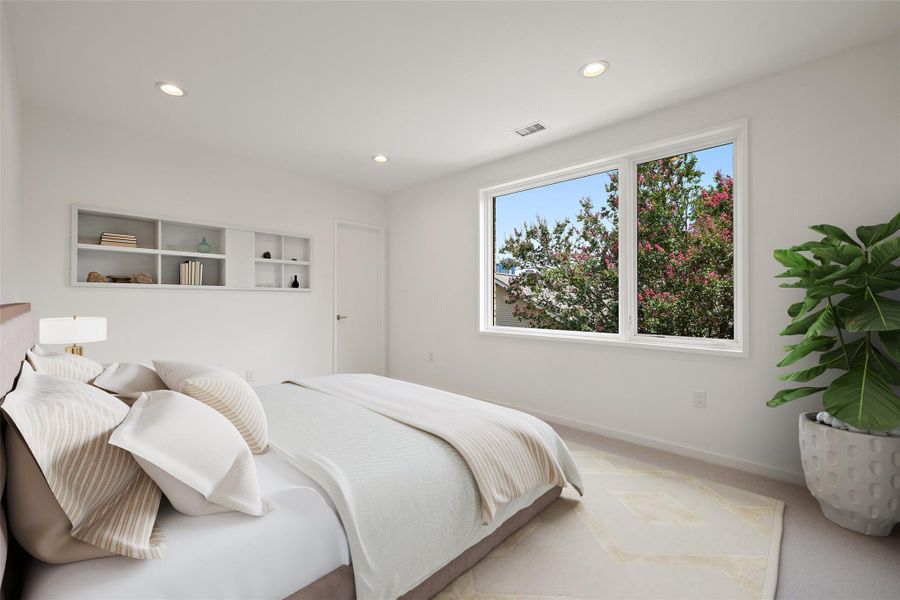 Carpeted bedroom with recessed lighting and baseboards