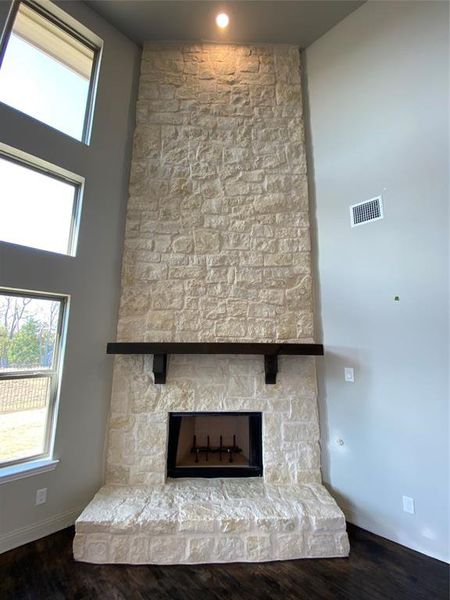 Close-up of 20 ft stone fireplace with cedar mantle which can use GAS or wood-burning