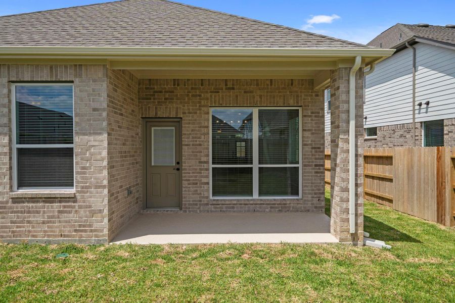 Exterior details and patio area of a home in Sunterra, Katy (Image 3). Exterior details and patio area of a home in Sunterra, Katy (Image 3).