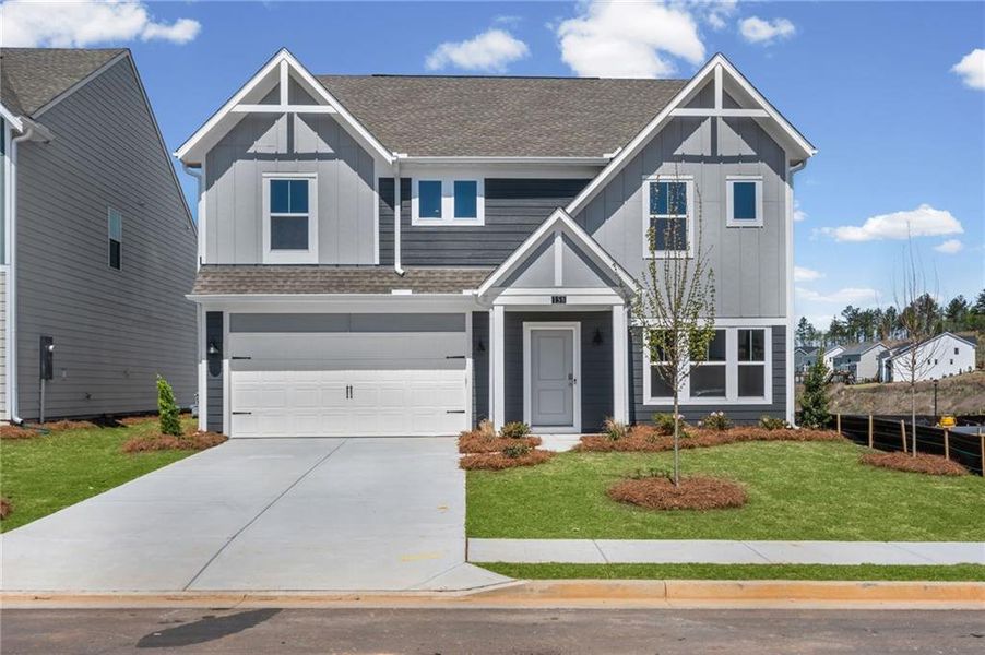 Front exterior of a new home in Twin Lakes, Hoschton, GA, highlighting curb appeal (Image 27).