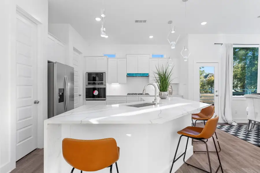 Bright and modern kitchen showcasing clean lines and designer finishes.