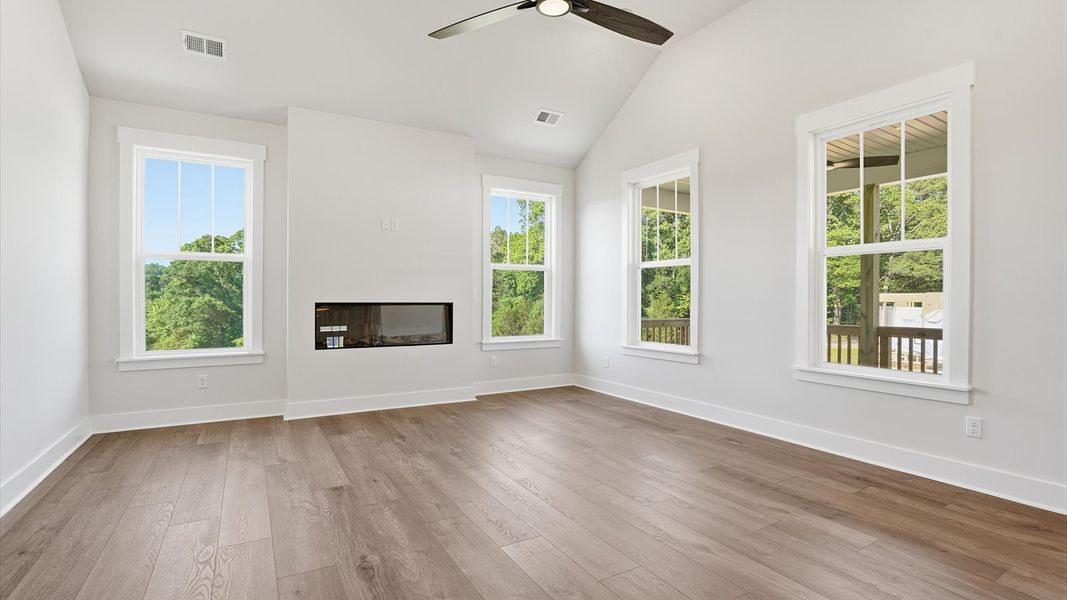 Tasteful family room with two-story volume, refined finishes, and exceptional natural light located in Woodruff, SC Tasteful family room with two-story volume, refined finishes, and exceptional natural light located in Woodruff, SC