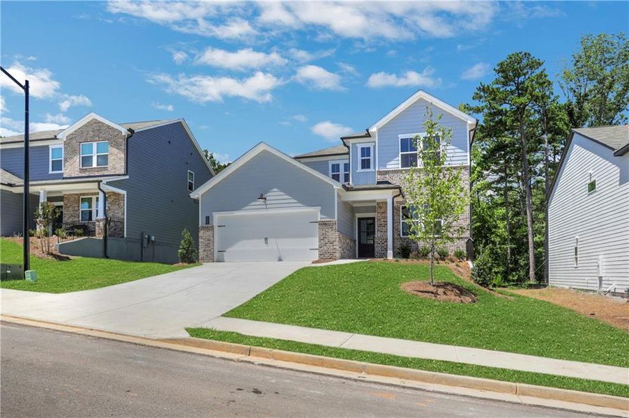 Front exterior of a new home in Cambridge at Steels Bridge, Canton, GA, highlighting curb appeal (Image 17).