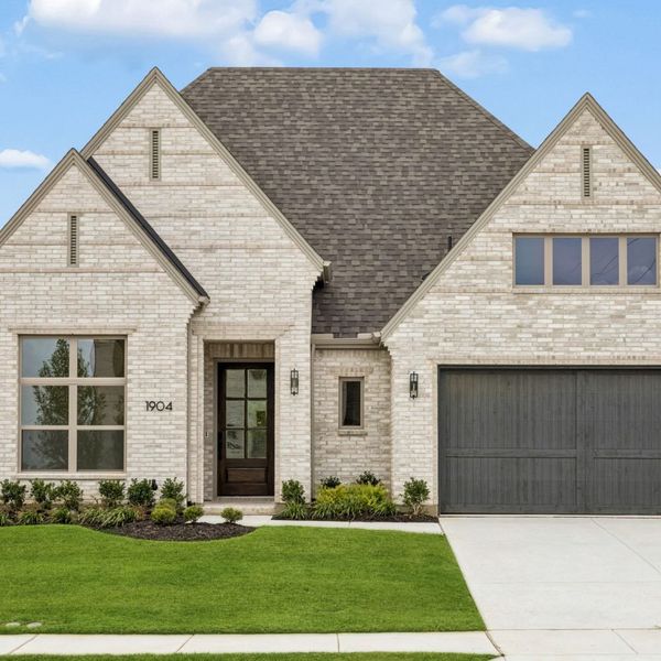 Front exterior of a new home in The Parks at Wilson Creek, Celina, TX, highlighting curb appeal (Image 2). Front exterior of a new home in The Parks at Wilson Creek, Celina, TX, highlighting curb appeal (Image 2).