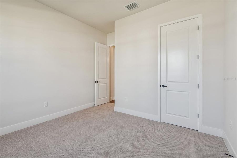 Spacious, unfurnished interior of a new home in Emerald Landing at Waterside at Lakewood Ranch – Cottage Series, Sarasota (Image 20).